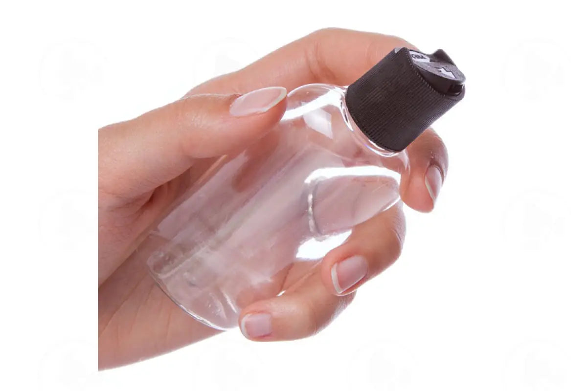 2 Oz. Oval Bottle: Clear Plastic With Black Disc-Top Cap