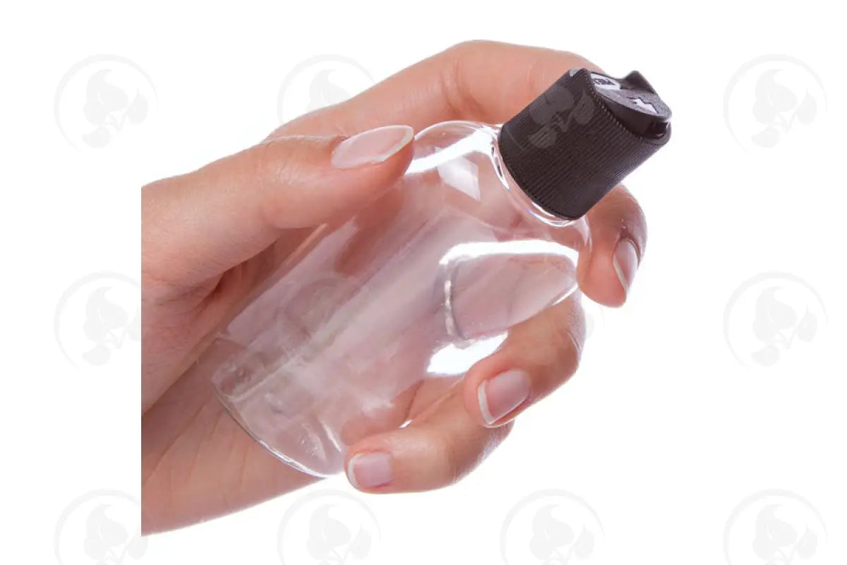 2 Oz. Oval Bottle: Clear Plastic With Black Disc-Top Cap